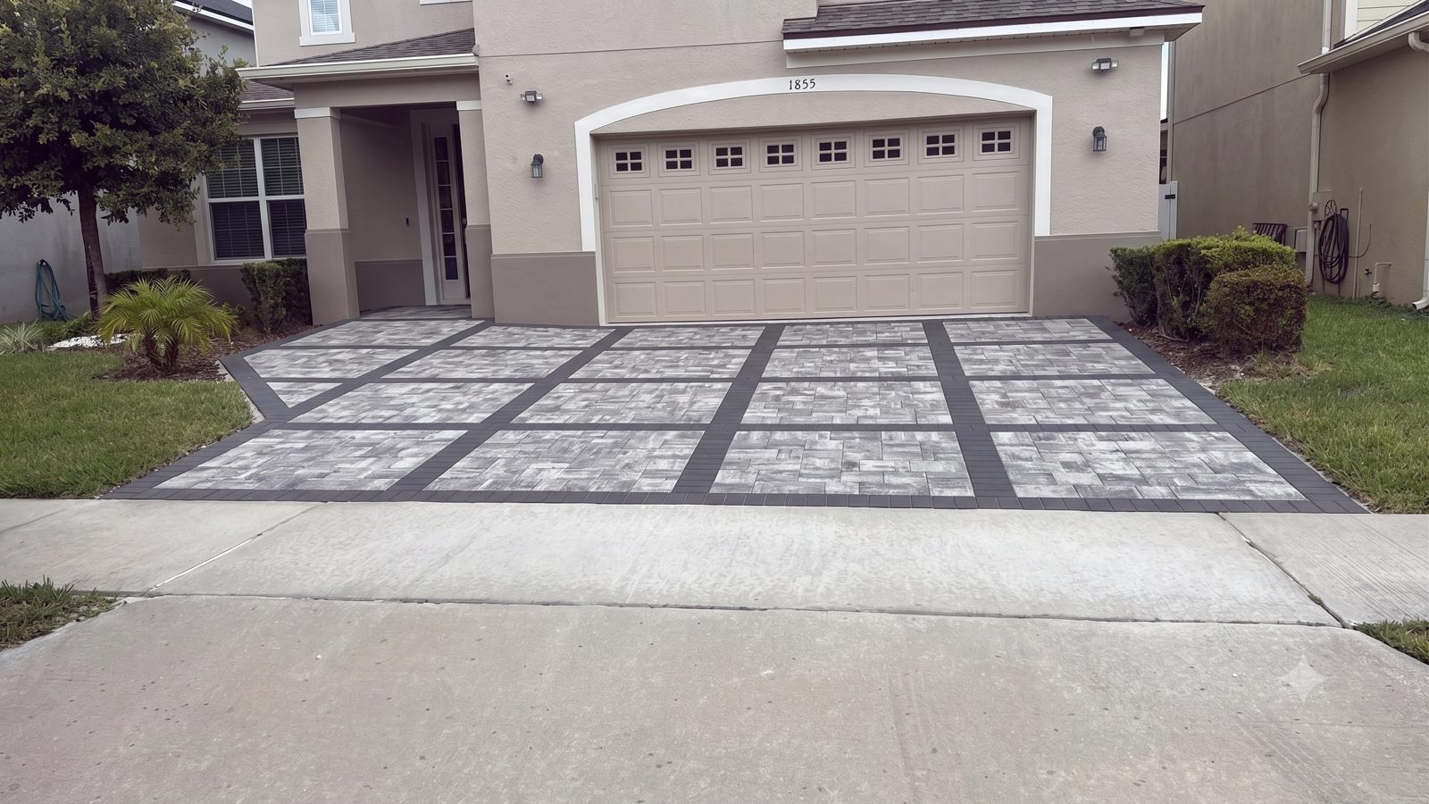 Paver driveway, charcoal border installed by Lakewood Ranch Concrete in Bradenton, FL